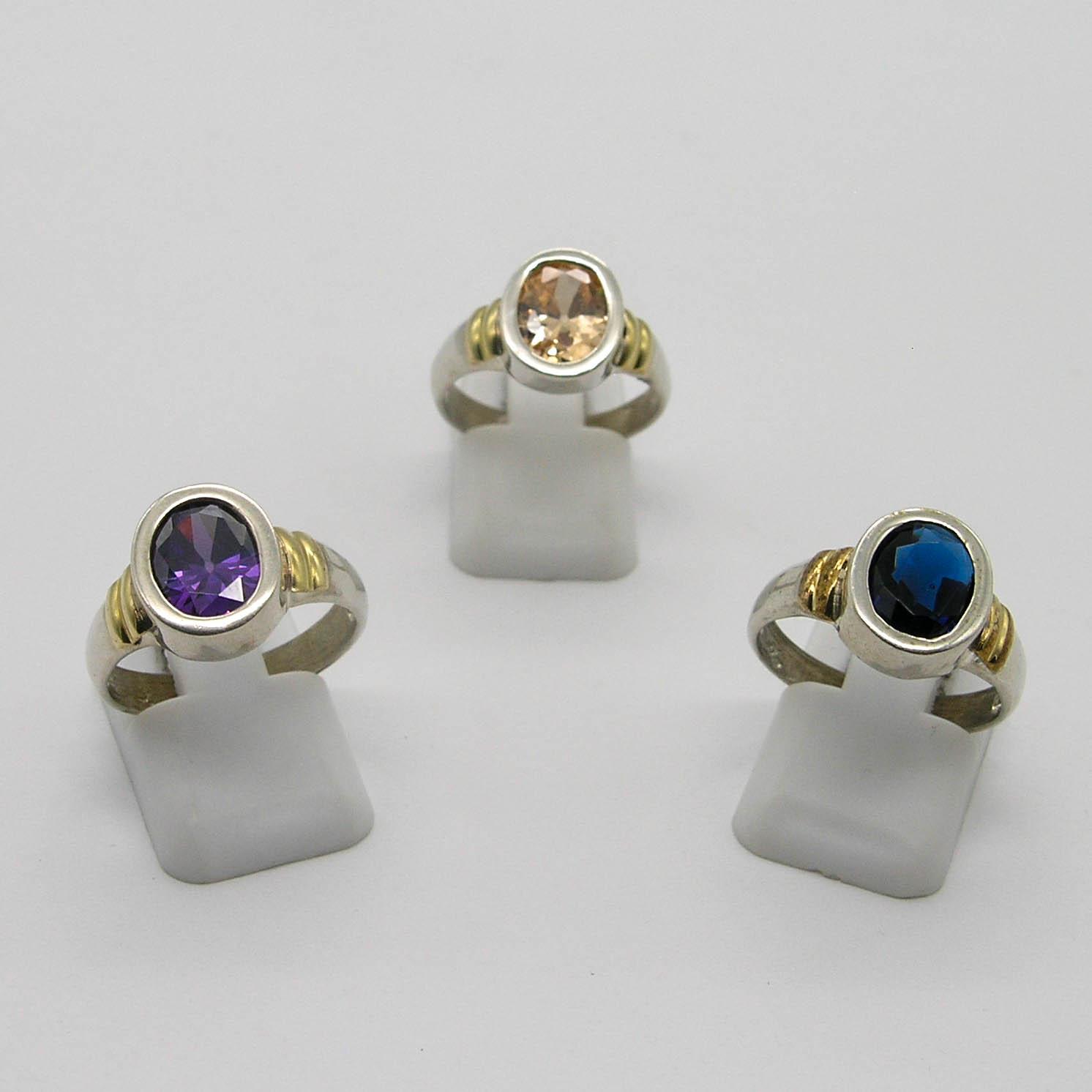 ANILLO CON PIEDRA OVAL /PLATA Y ORO
